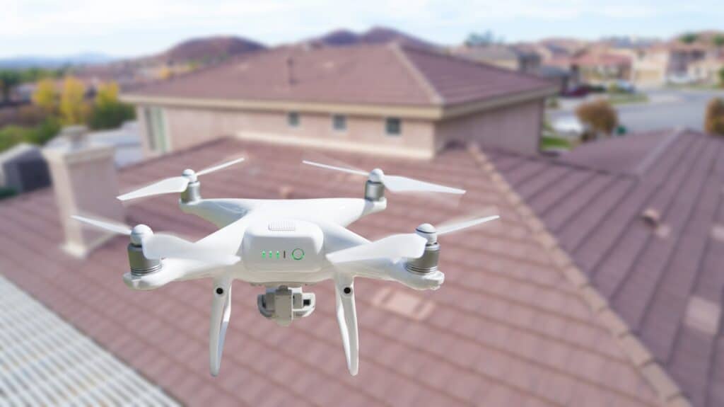 a drone inspecting a roof for roof leaks, roof damage, and doing a full roof inspection for homeowners insurance roof claim.