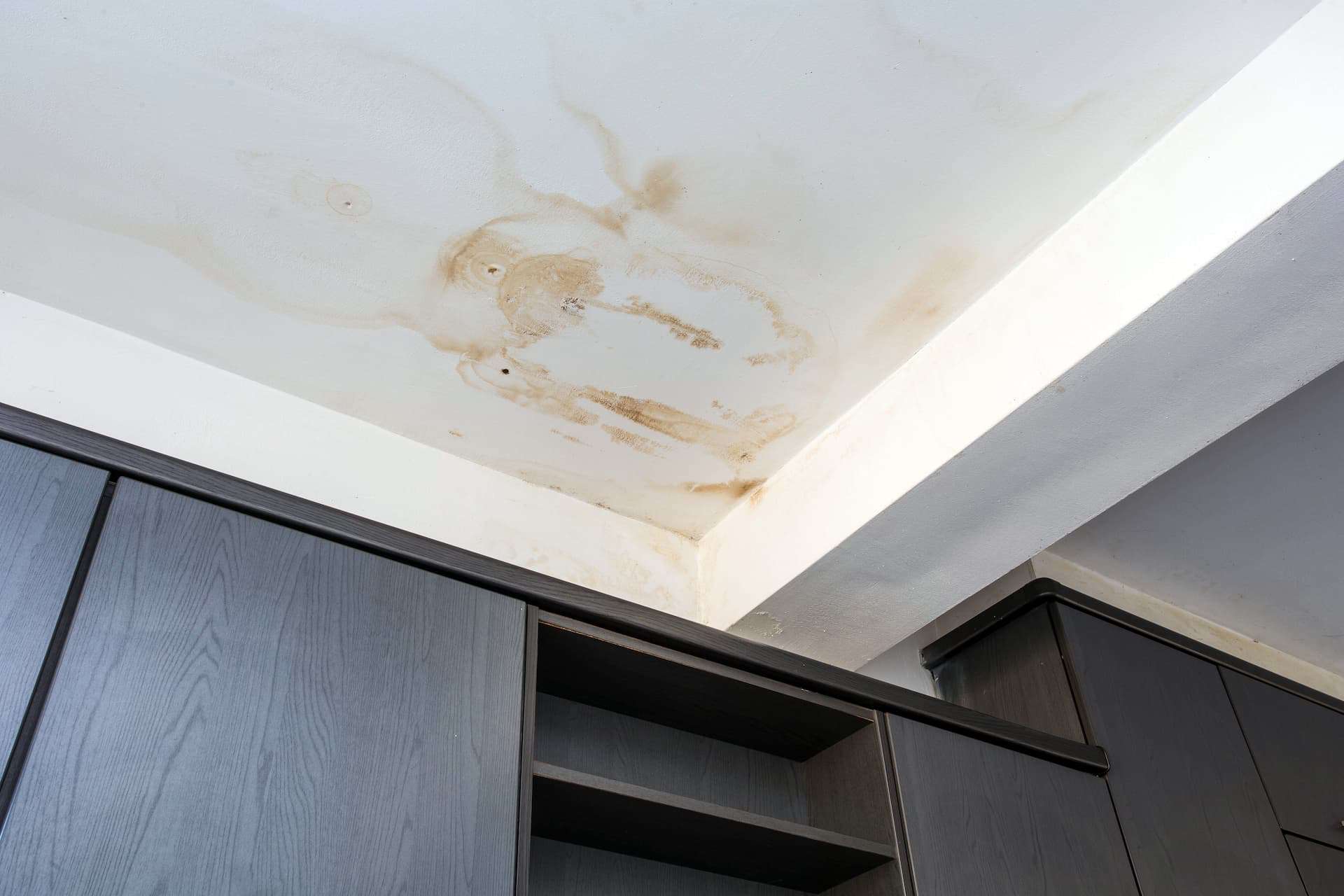 Ceiling in a home with damage from roof leak