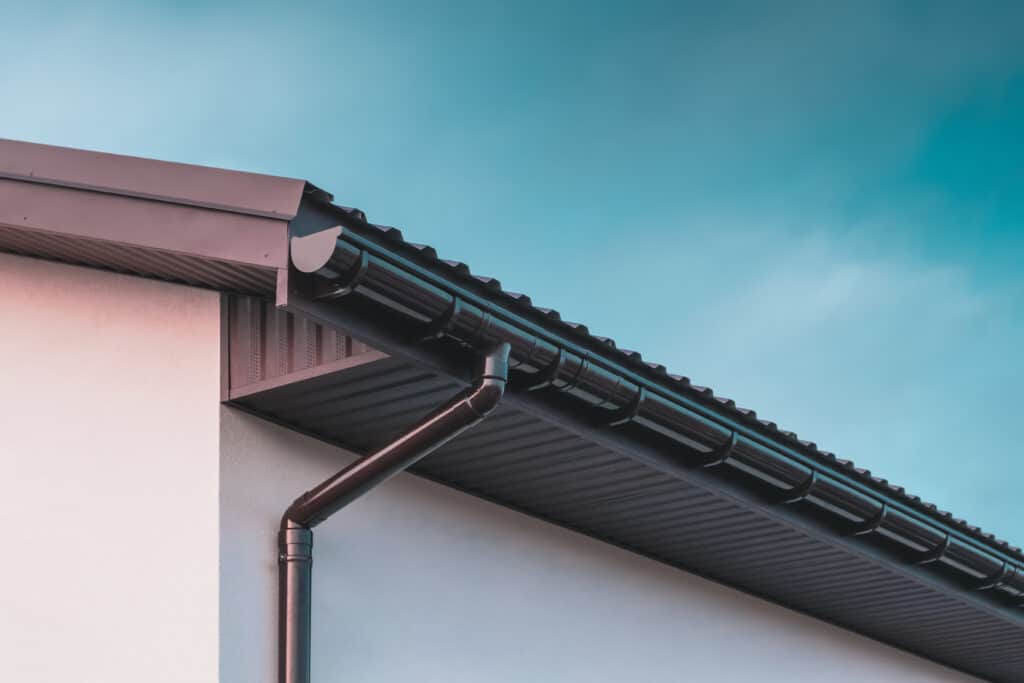 installed roof downspout directing water away from the homes foundation