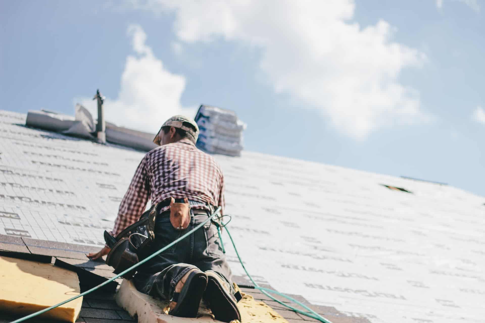 Roofer doing a shingle roof replacement