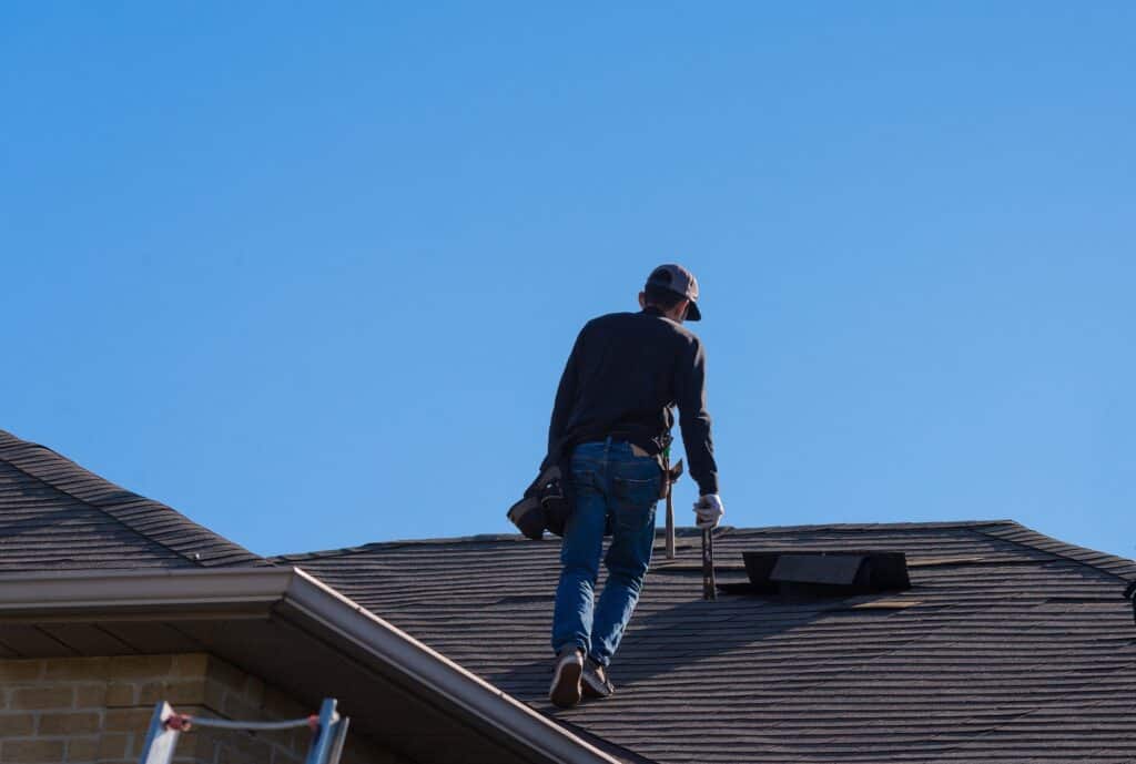 roof inspector finding a roof leak on a shingle roof