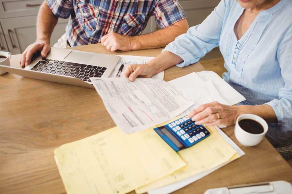 older couple looking at roofing costs