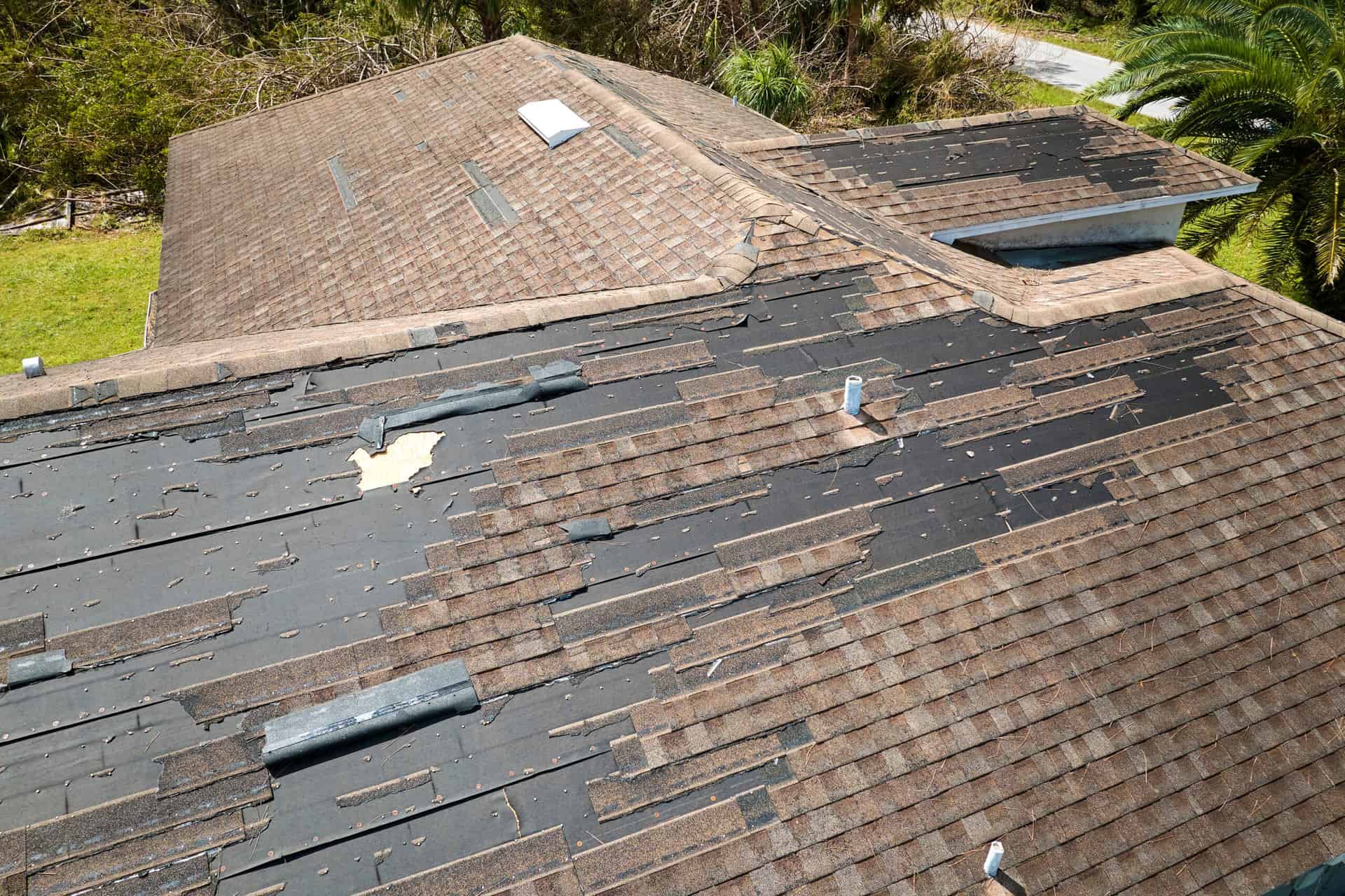 Drone image of a shingle roof with wind damage